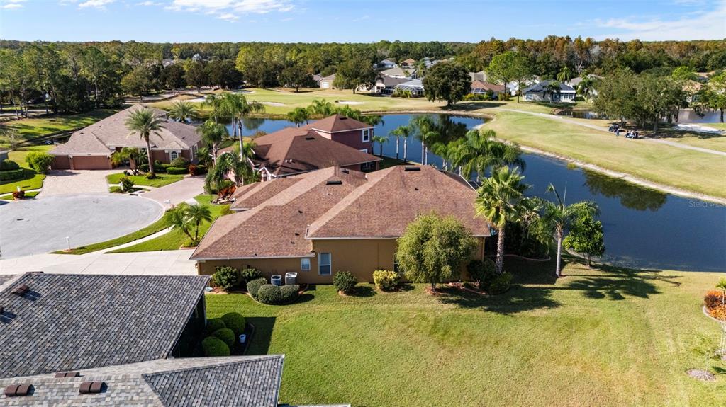 25745 Unbridled Court Wesley Chapel, FL 33544 - Photo 54 of 64 an aerial view of residential houses and outdoor space