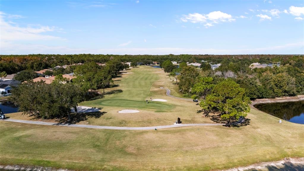 25745 Unbridled Court Wesley Chapel, FL 33544 - Photo 56 of 64 a view of a lake