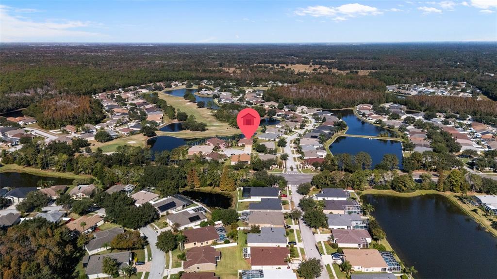 25745 Unbridled Court Wesley Chapel, FL 33544 - Photo 59 of 64 an aerial view of multiple house
