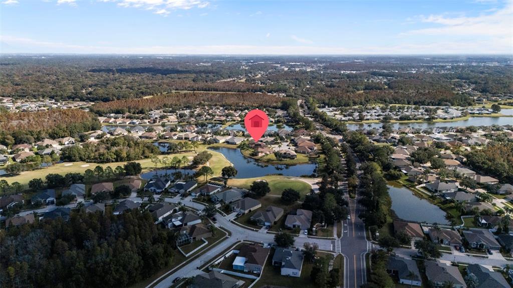 25745 Unbridled Court Wesley Chapel, FL 33544 - Photo 61 of 64 an aerial view of multiple house