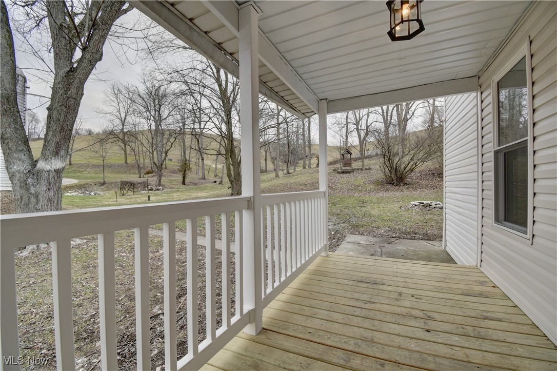 10337 Ragersville Road Southwest Baltic, OH 43804 - Photo 27 of 35 Wooden terrace with covered porch