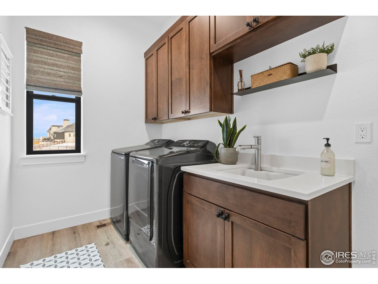 1907 Spring Bloom Drive Windsor, CO 80550 - Photo 16 of 49 Laundry room conveniently located near Primary Suite