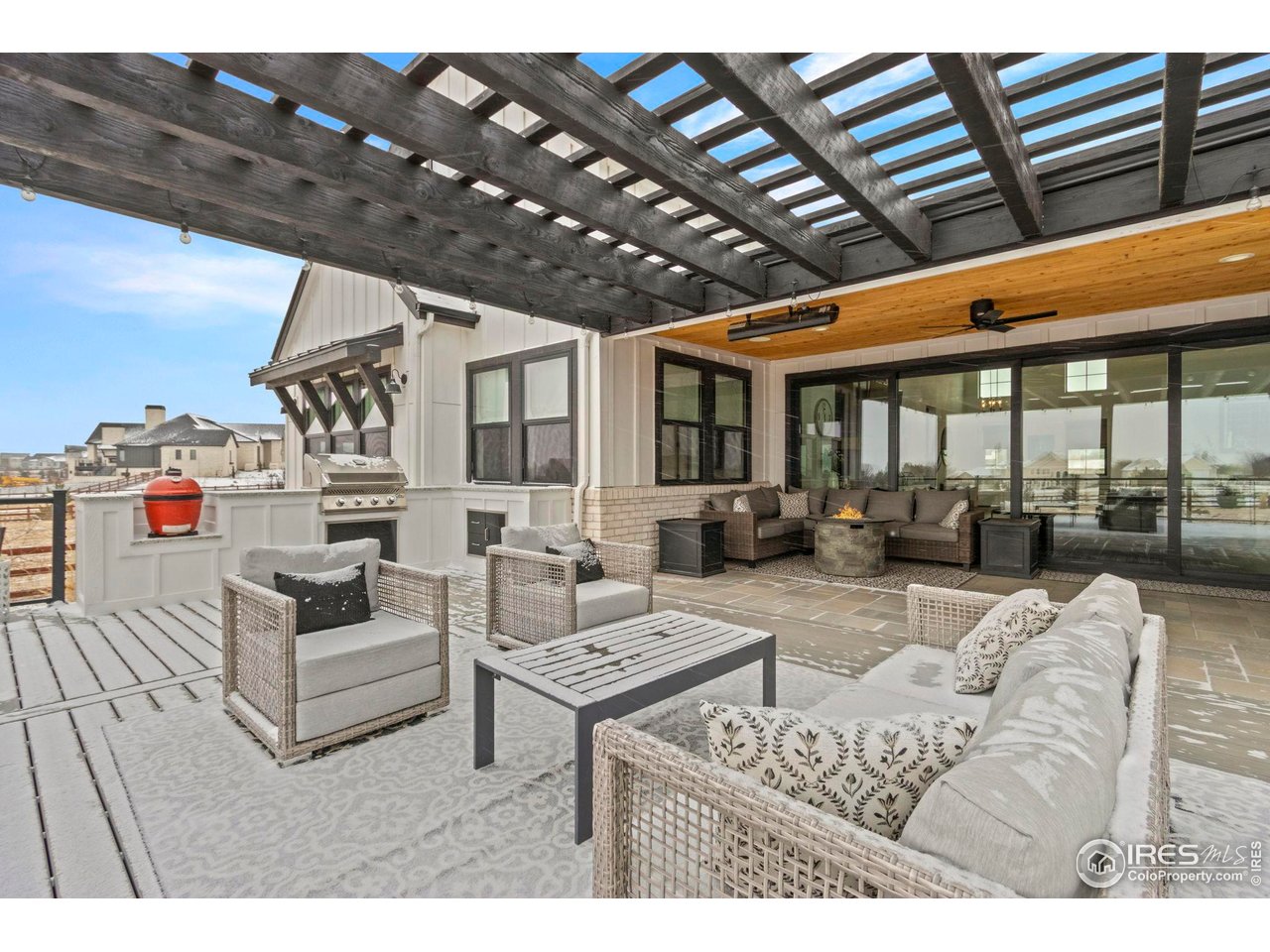 1907 Spring Bloom Drive Windsor, CO 80550 - Photo 7 of 49 Open patio area with pergola and cook station