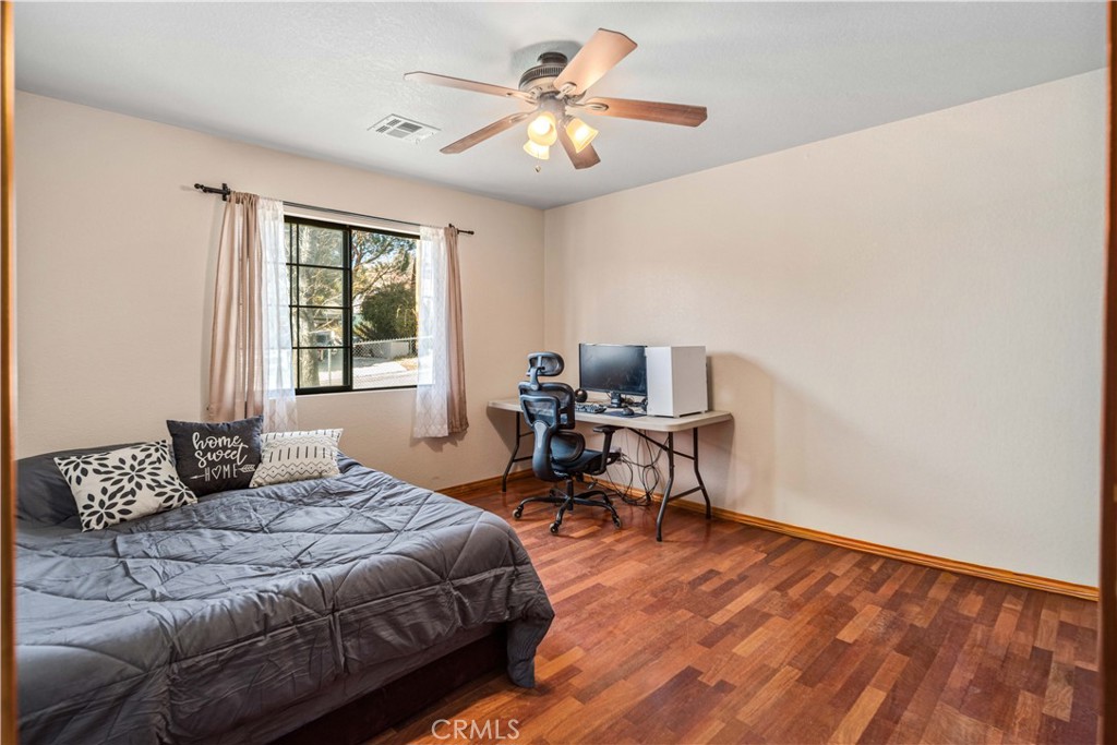 43230 Lookabout Road Lake Hughes, CA 93532 - Photo 14 of 40 a bedroom with a bed and a window