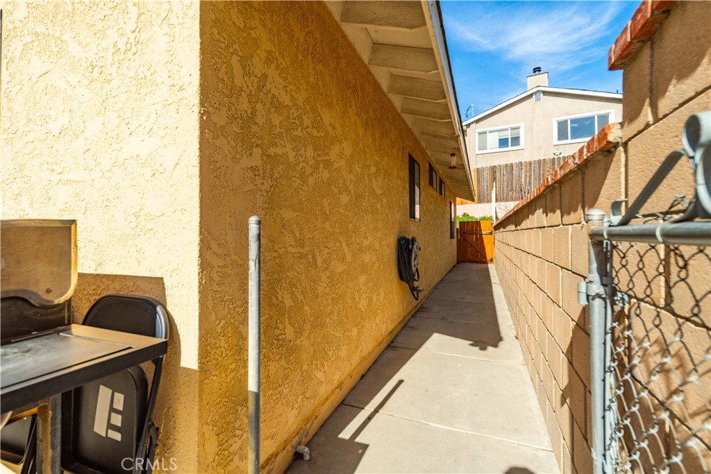 43230 Lookabout Road Lake Hughes, CA 93532 - Photo 26 of 40 a view of a balcony with furniture and a floor to ceiling window