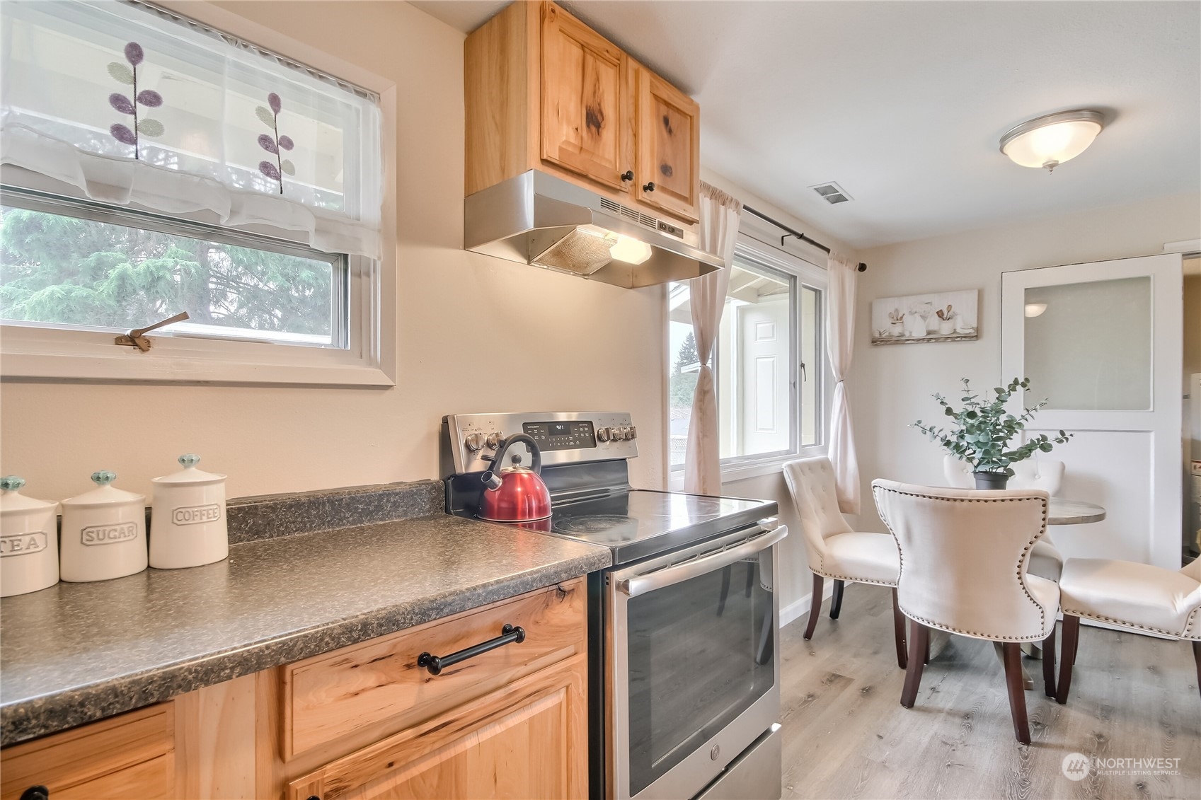 3513 Northeast 9th Street Renton, WA 98056 - Photo 17 of 40 a kitchen with a sink cabinets and wooden floor