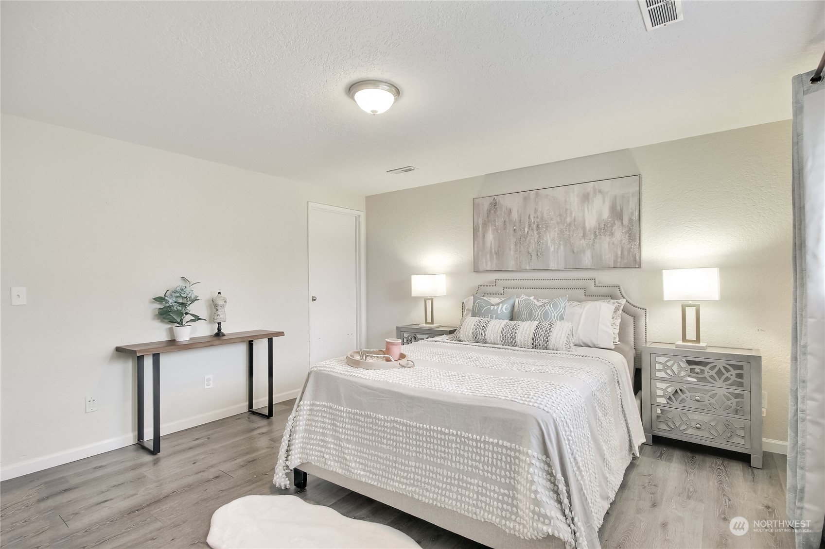 3513 Northeast 9th Street Renton, WA 98056 - Photo 21 of 40 a bedroom with a bed and a couch