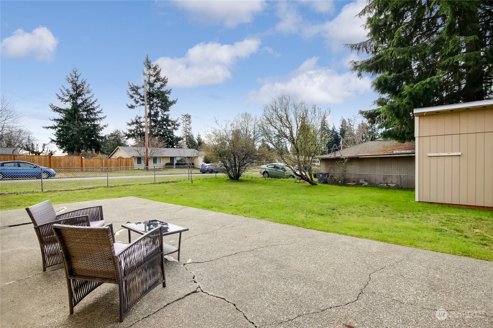3513 Northeast 9th Street Renton, WA 98056 - Photo 31 of 40 a view of a table and chairs in the garden