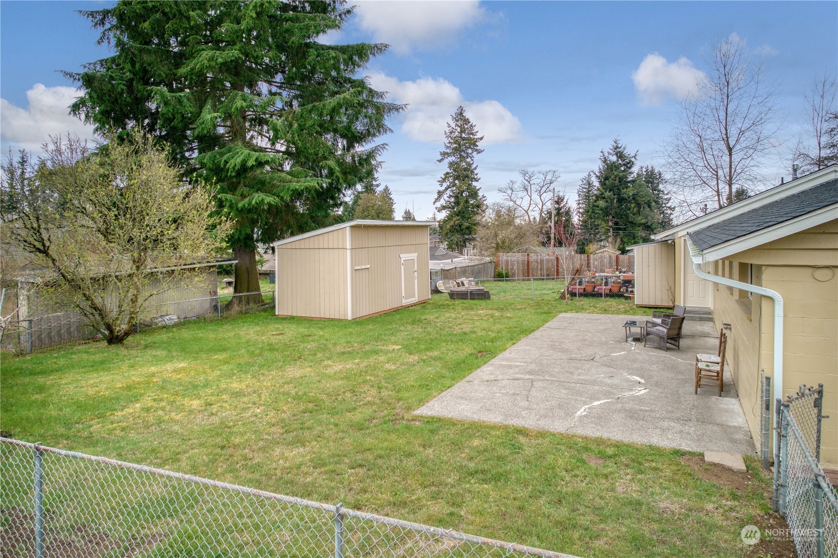 3513 Northeast 9th Street Renton, WA 98056 - Photo 32 of 40 a backyard of a house with plants and a patio