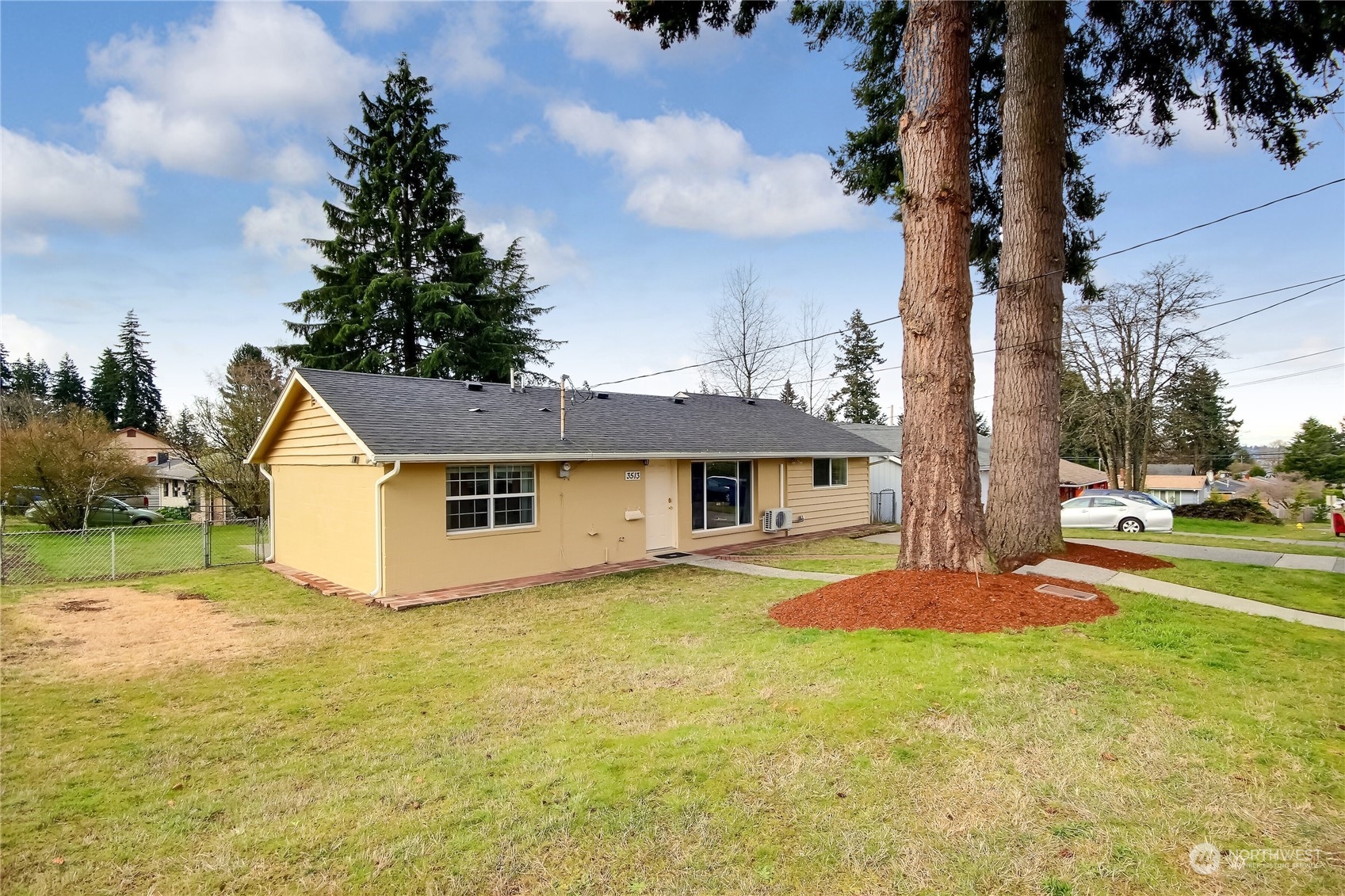 3513 Northeast 9th Street Renton, WA 98056 - Photo 4 of 40 a view of a house with a yard and tree s