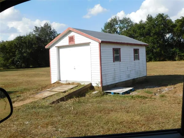 a view of backyard of house