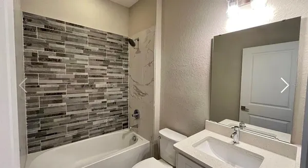 a bathroom with a sink and a bathtub