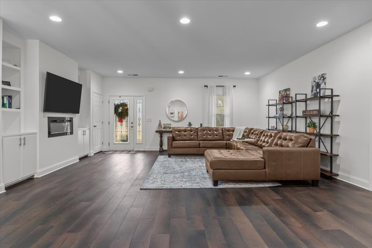 8011 Valley Road Nunnelly, TN 37137 - Photo 8 of 42 a living room with furniture and a flat screen tv