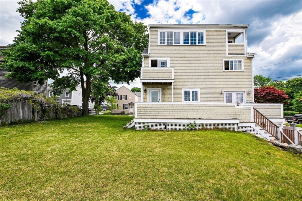 16 Middle Street Fairhaven, MA 02719 - Photo 28 of 34 a view of a house with a backyard porch and sitting area