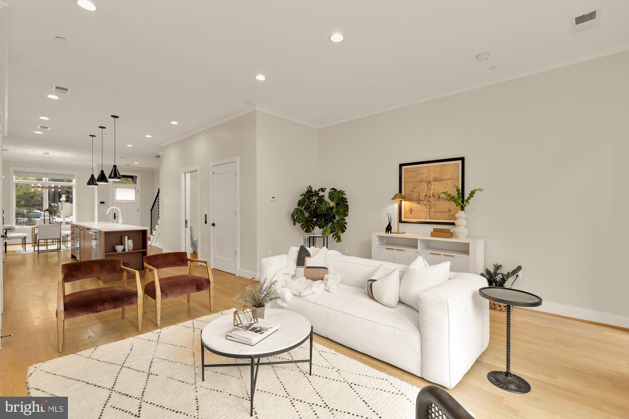 1311 D Street Southeast Washington, DC 20003 - Photo 20 of 57 a living room with furniture a couch and kitchen view