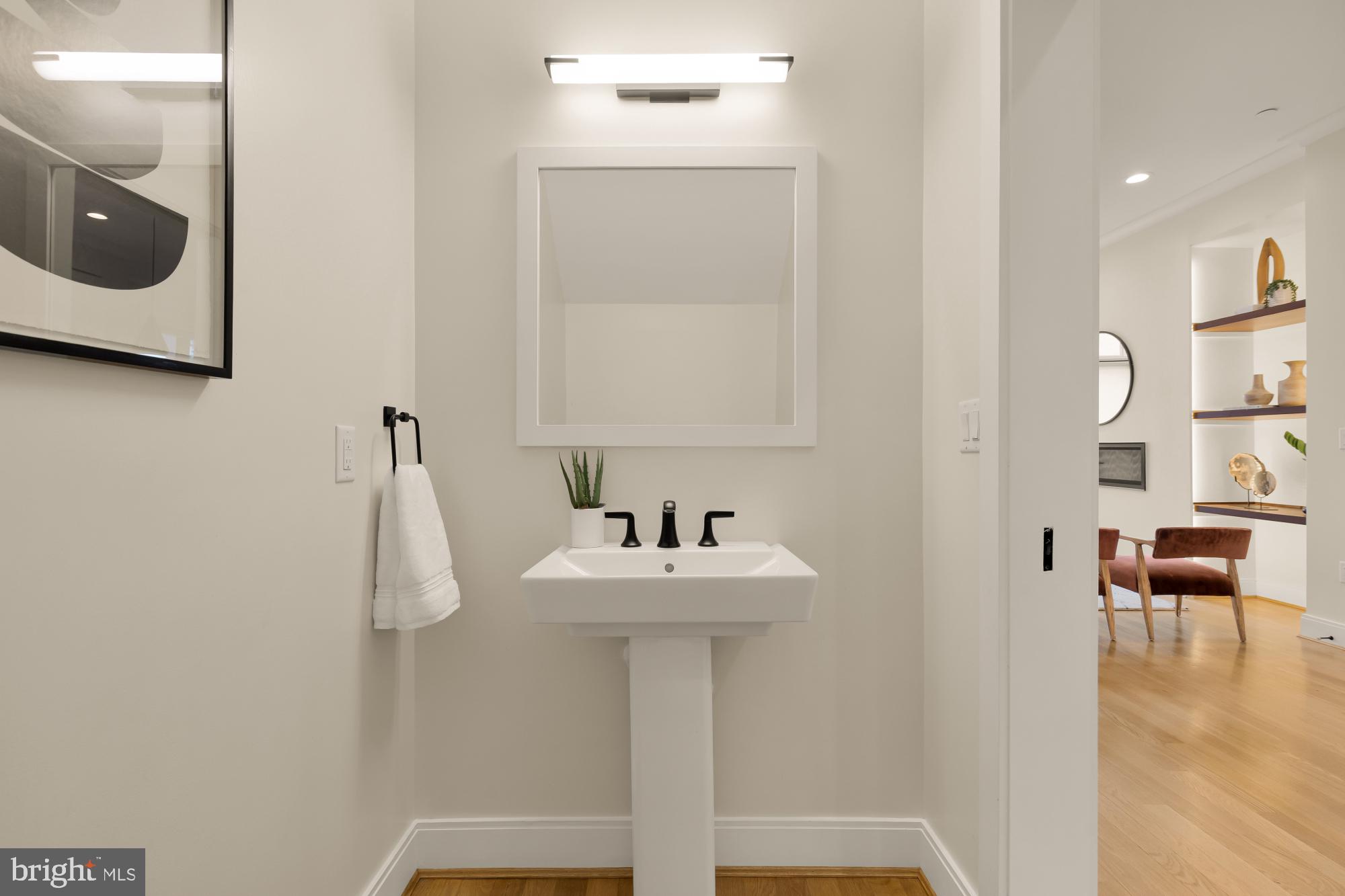 1311 D Street Southeast Washington, DC 20003 - Photo 22 of 57 a bathroom with a sink and a mirror