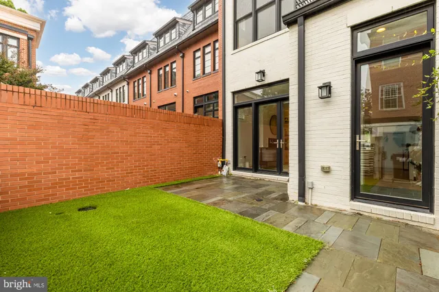 a front view of a building with many windows
