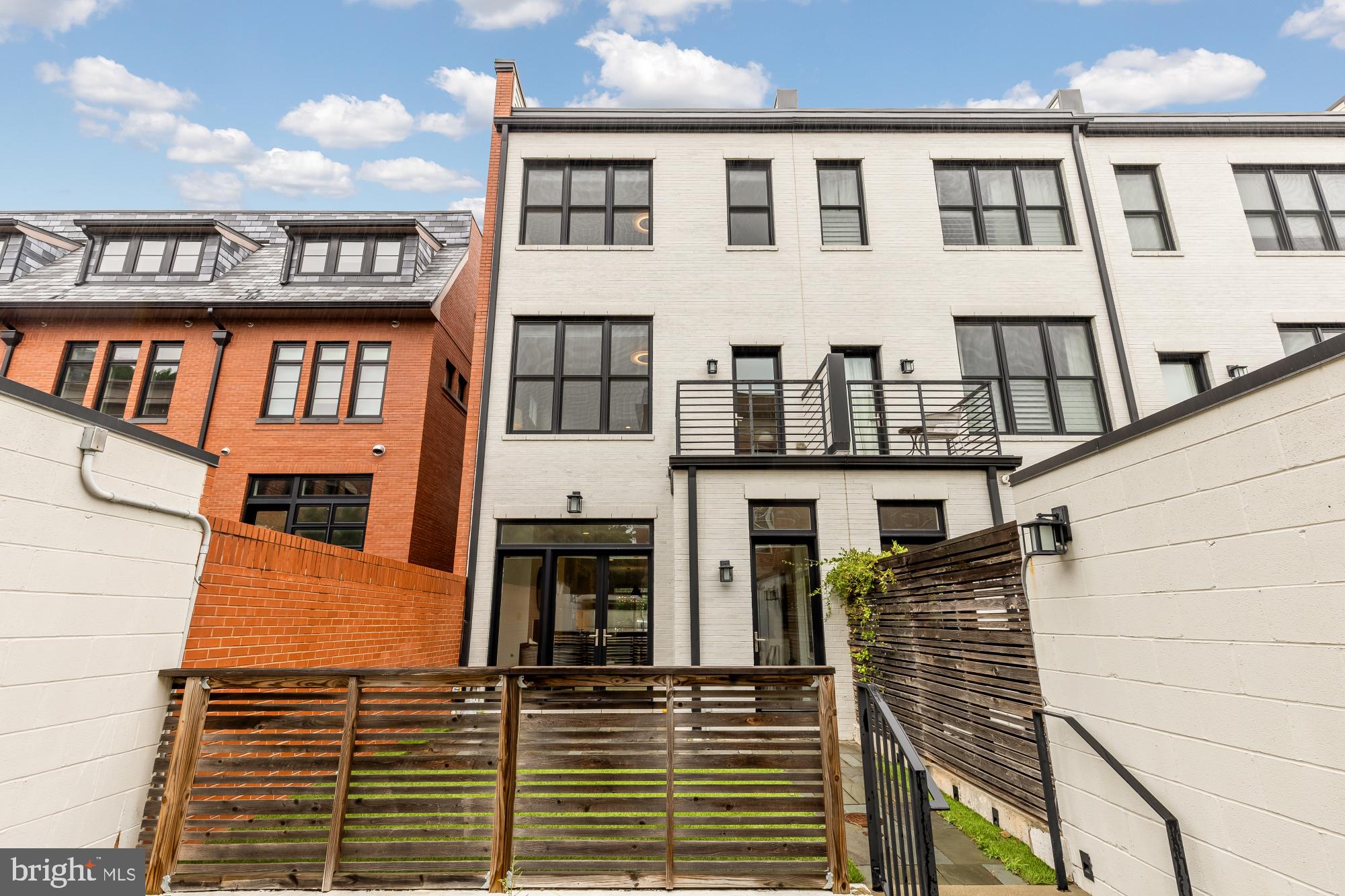 1311 D Street Southeast Washington, DC 20003 - Photo 27 of 57 a front view of a building with many windows