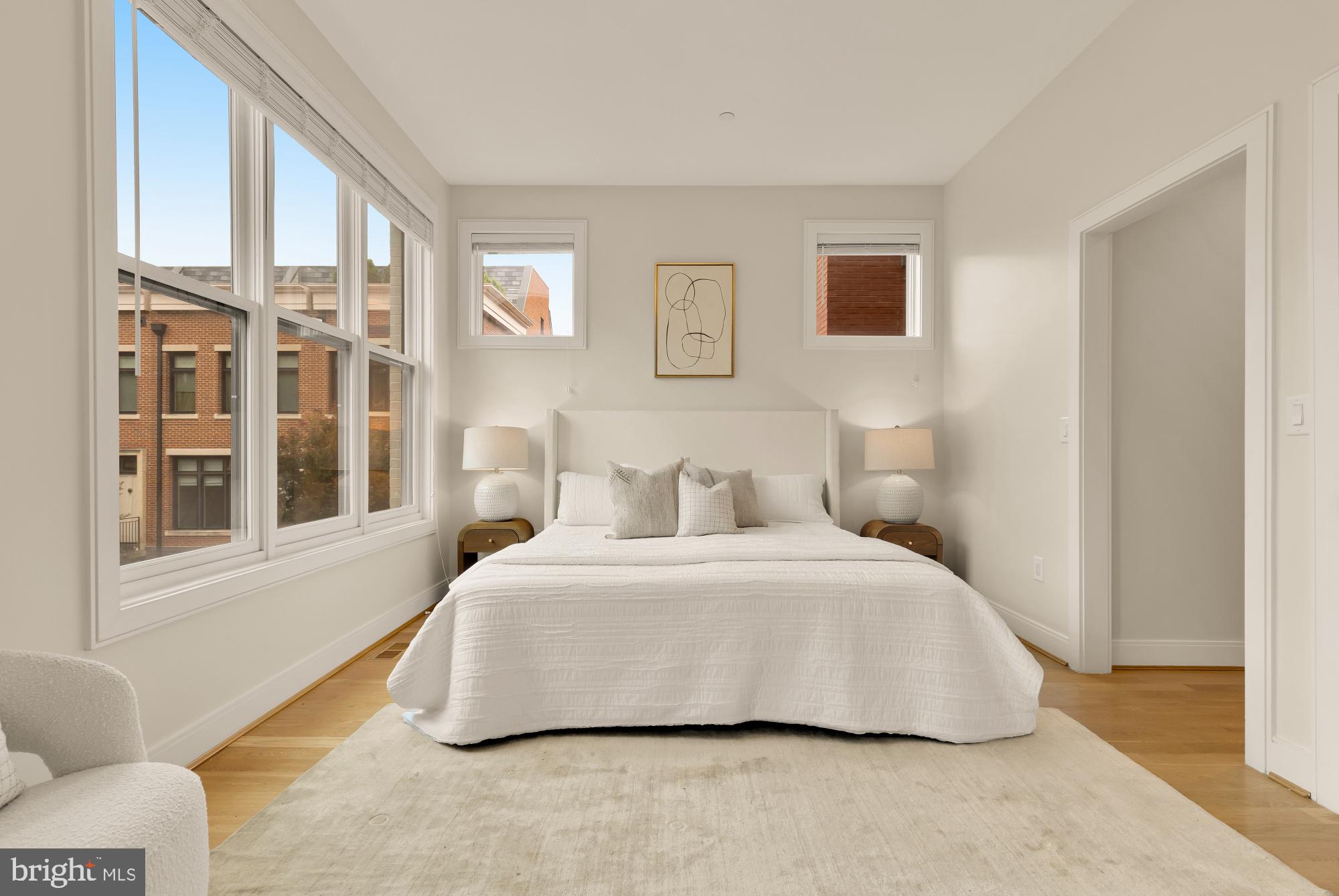 1311 D Street Southeast Washington, DC 20003 - Photo 29 of 57 a bedroom with a bed and a large window