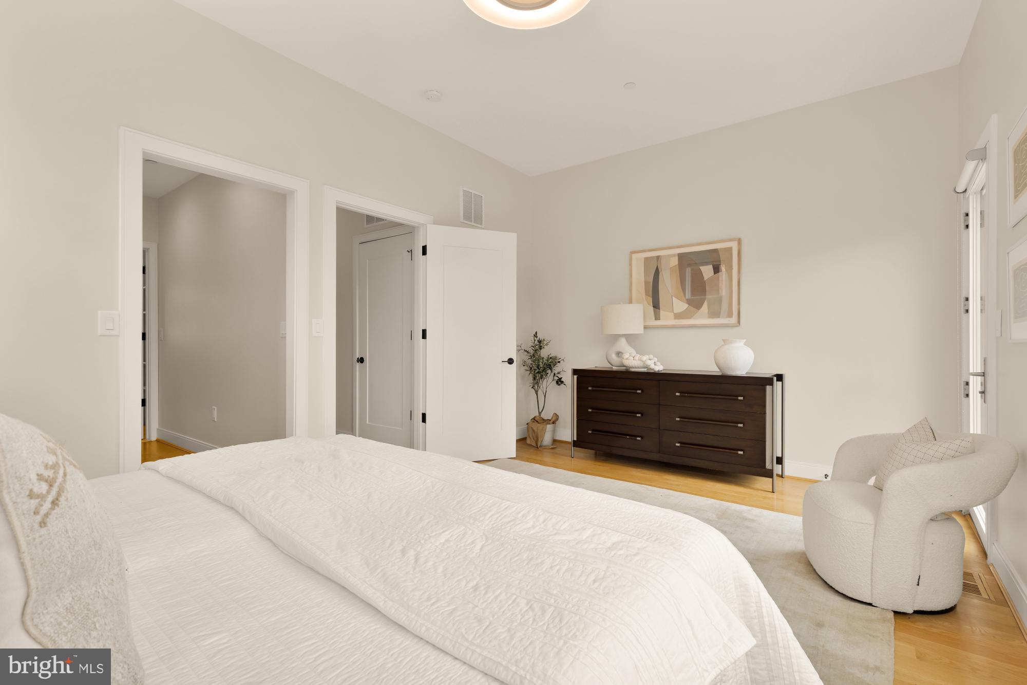 1311 D Street Southeast Washington, DC 20003 - Photo 30 of 57 a bedroom with a bed and a couch