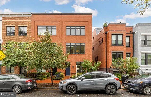 a front view of a multi story residential apartment building