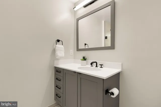 a bedroom with a bed dresser and a window