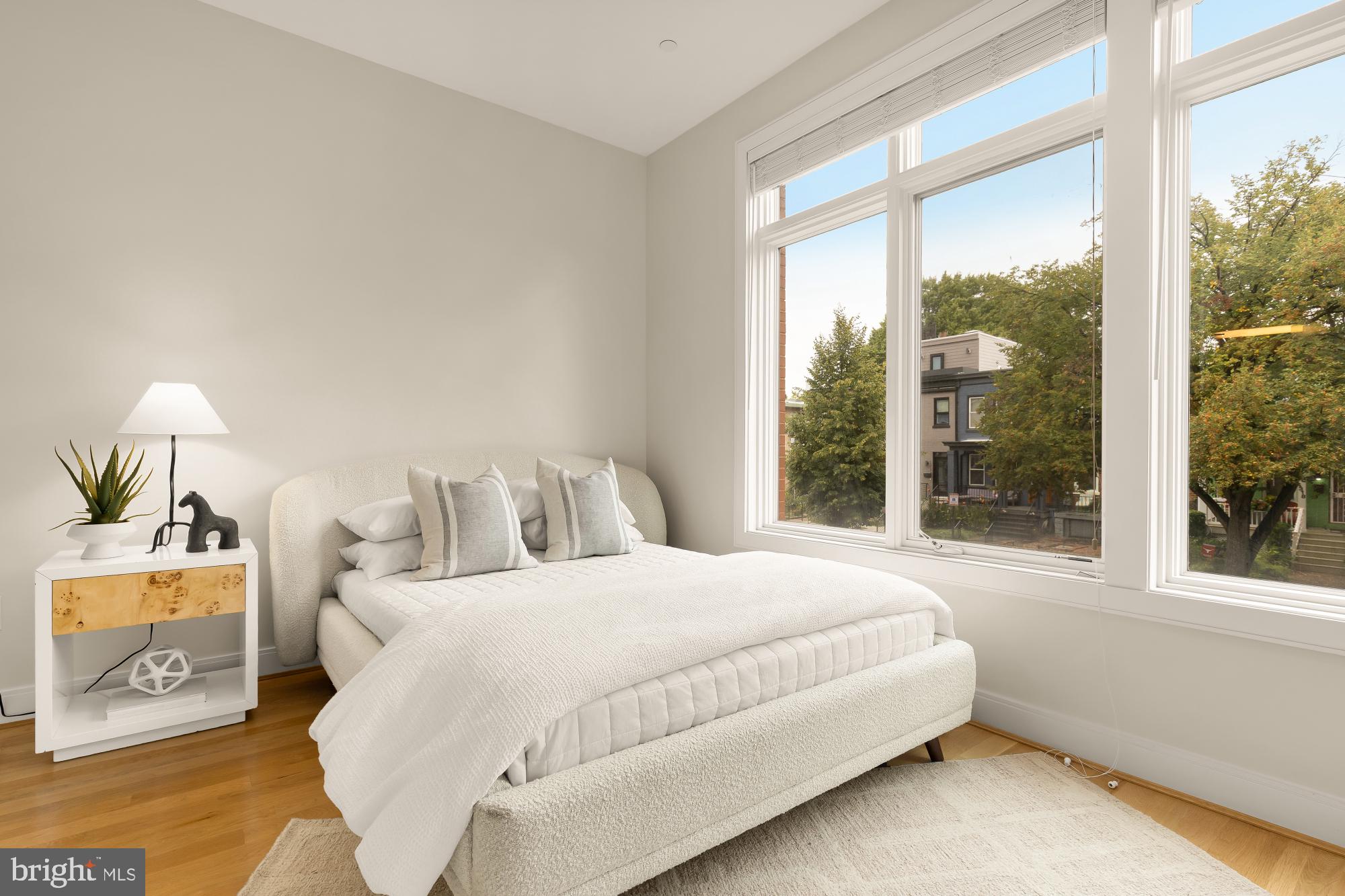 1311 D Street Southeast Washington, DC 20003 - Photo 48 of 57 a bedroom with bed and a large window