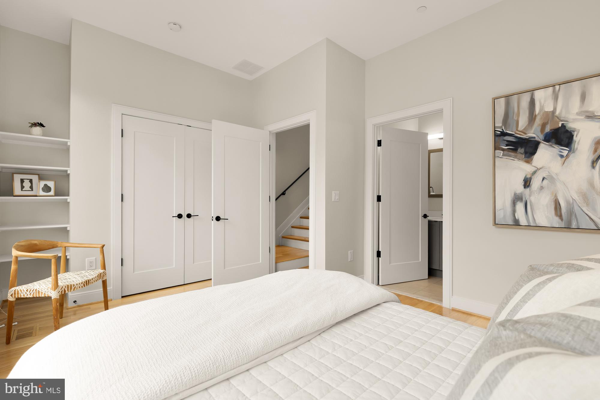 1311 D Street Southeast Washington, DC 20003 - Photo 50 of 57 a bedroom with a bed and a painting on the wall