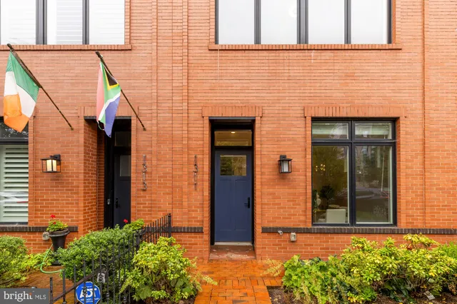 a view of kitchen with wooden floor and electronic appliances