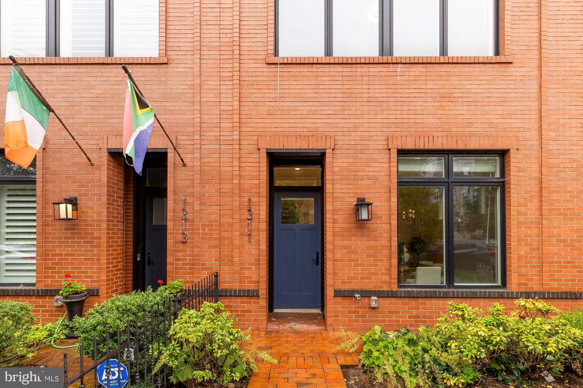 1311 D Street Southeast Washington, DC 20003 - Photo 5 of 57 front view of a brick house with a small window
