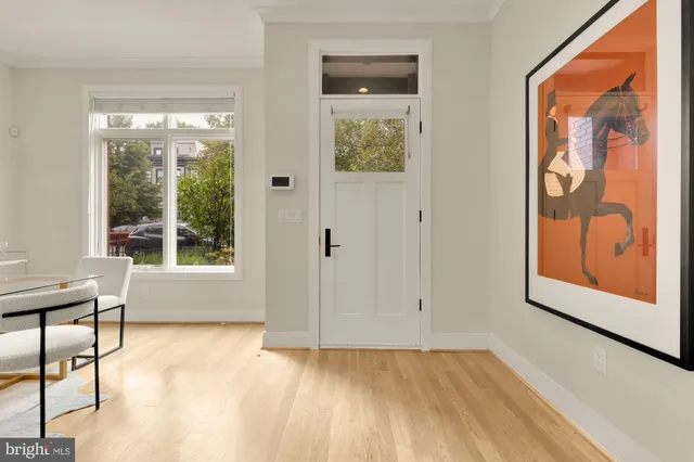 a view of a dining room with furniture window and wooden floor