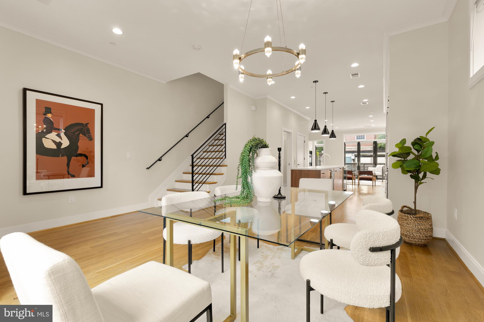 1311 D Street Southeast Washington, DC 20003 - Photo 10 of 57 a living room with furniture and a chandelier