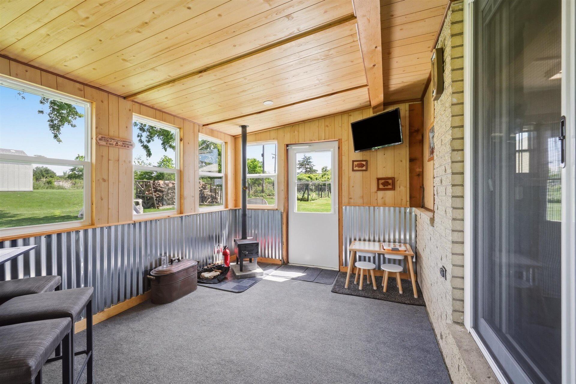 11610 West Sunnybrook Road Franklin, WI 53132 - Photo 25 of 34 Updated Sunroom w/ wood stove