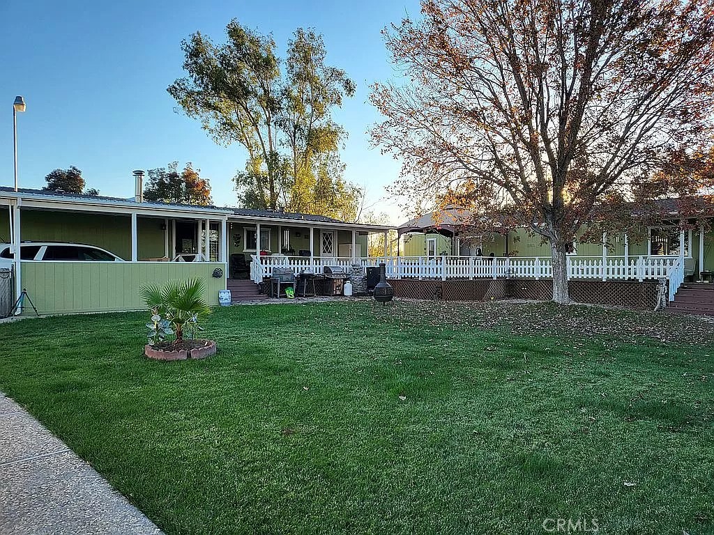 5675 Keene Road Corning, CA 96021 - Photo 1 of 2 a front view of house with yard and green space