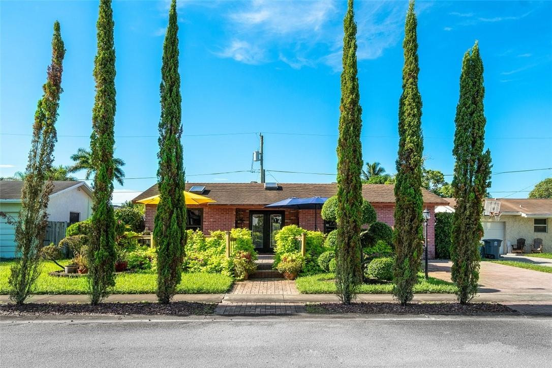 9732 Southwest 1st Place Boca Raton, FL 33428 - Photo 3 of 28 Cypress trees at front entry