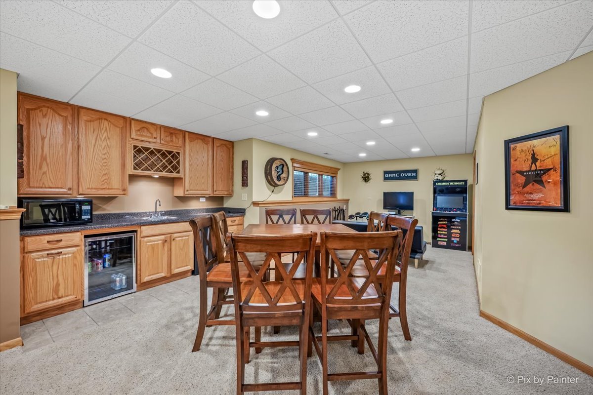 7104 Dove Way Cary, IL 60013 - Photo 44 of 82 a large kitchen with a table and chairs in it