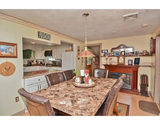 17 Ruthellen Road Chelmsford, MA 01824 - Photo 14 of 42 a dining room with furniture and a kitchen view