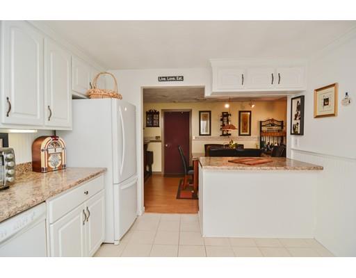 17 Ruthellen Road Chelmsford, MA 01824 - Photo 20 of 42 a kitchen with stainless steel appliances granite countertop a refrigerator and a stove