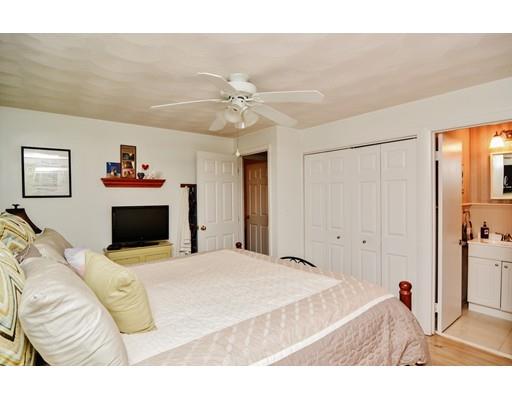 17 Ruthellen Road Chelmsford, MA 01824 - Photo 22 of 42 a bedroom with a bed and a chandelier