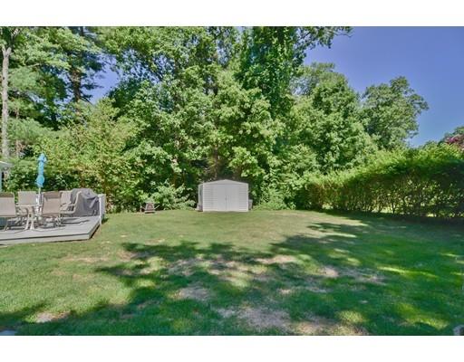 17 Ruthellen Road Chelmsford, MA 01824 - Photo 42 of 42 a backyard of a house with table and chairs