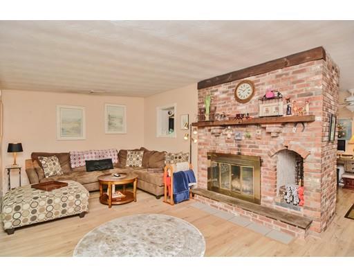 17 Ruthellen Road Chelmsford, MA 01824 - Photo 5 of 42 a living room with furniture and a fireplace