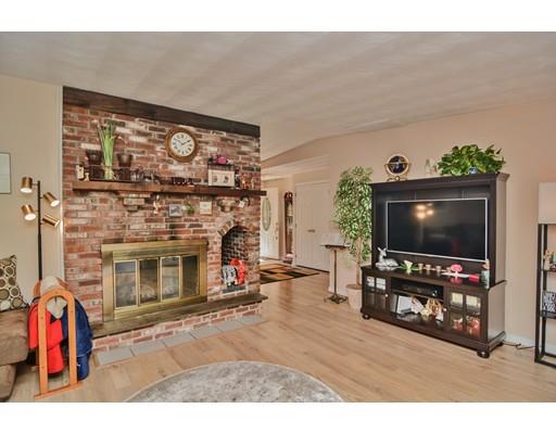 17 Ruthellen Road Chelmsford, MA 01824 - Photo 6 of 42 a living room with furniture and a flat screen tv