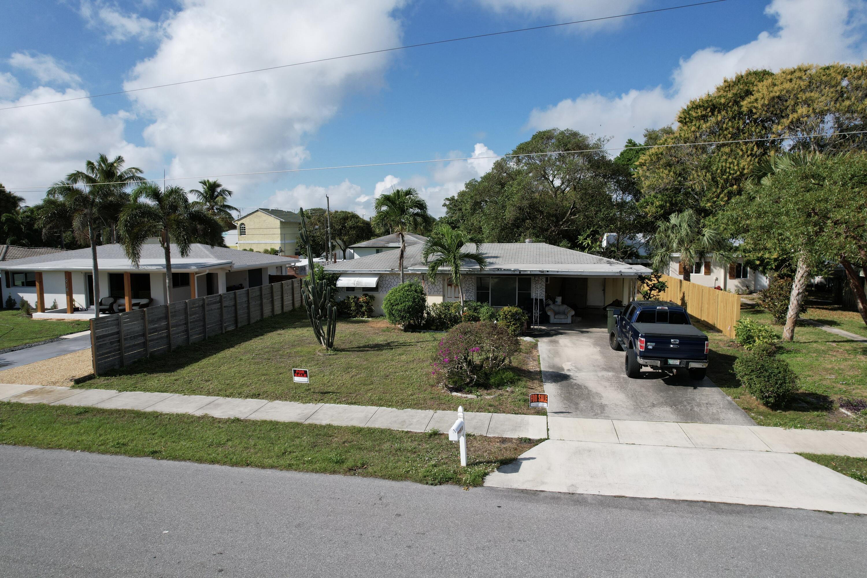 a view of house with yard and entertaining space