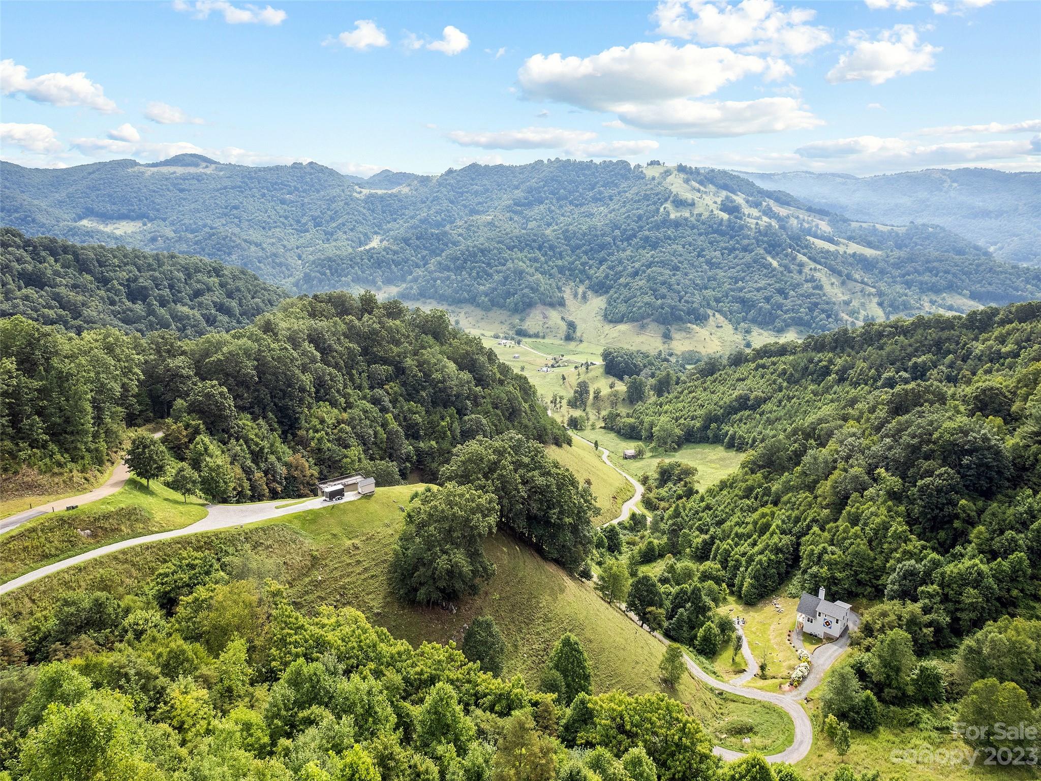 0 Yonaguska Ridge, Unit B Clyde, NC 28721 - Photo 6 of 10 a view of a lush green hillside and a mountain