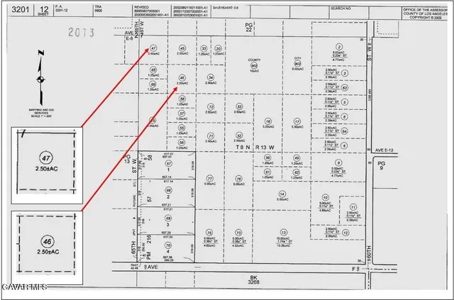 a view of a hallway with wooden stairs