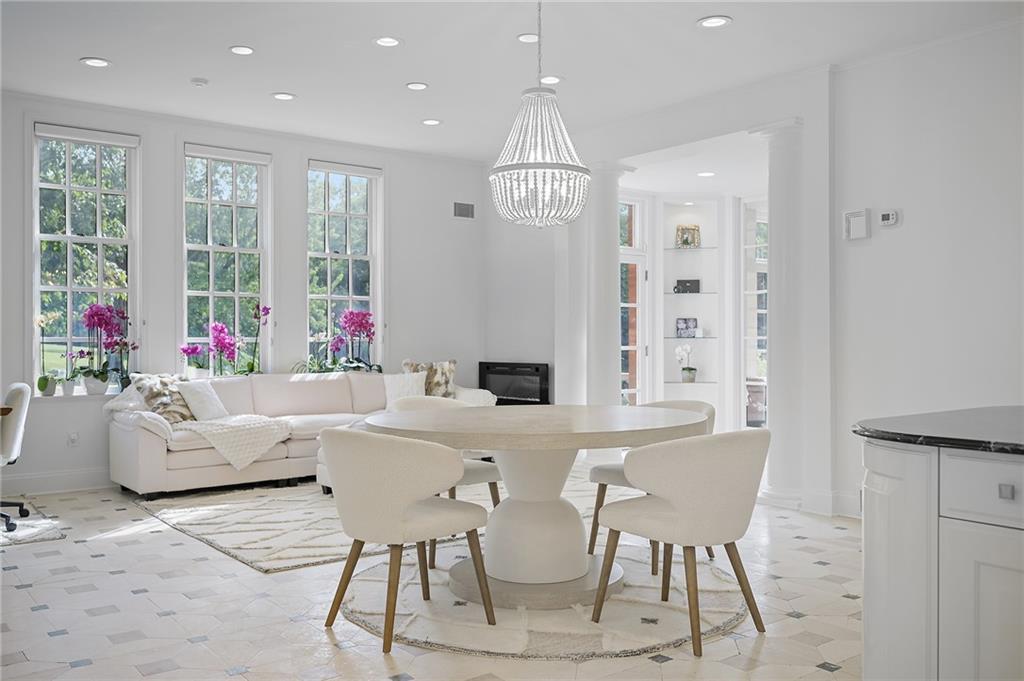 898 Persimmon Road Sewickley, PA 15143 - Photo 25 of 50 An adjoining open area accommodating both dining and a large seating arrangement, creating a true gathering space.