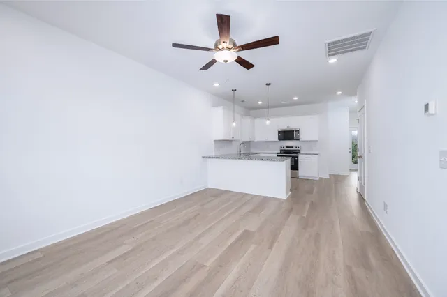 a view of kitchen with wooden floor