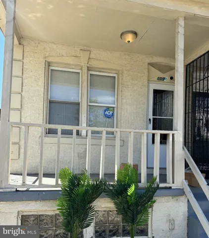 a house with a potted plant in front of it