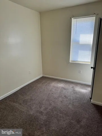 an empty room with a mirror