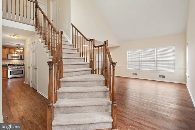 a view of an entryway with wooden floor and windows